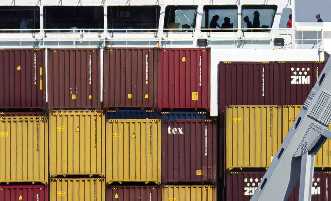 People are seen aboard the container ship Dali, Monday, April 15, 2024, in Baltimore. The FBI confirmed that agents were aboard the Dali conducting court-authorized law enforcement activity. (AP Photo/Julia Nikhinson)