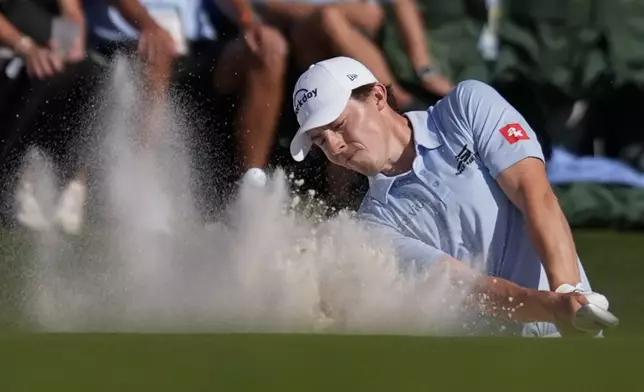 Ludvig Aberg, of Sweden, hits from the bunker on the 18th hole during final round at the Masters golf tournament at Augusta National Golf Club Sunday, April 14, 2024, in Augusta, Ga. (AP Photo/Ashley Landis)