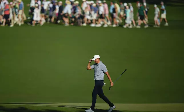 Ludvig Aberg, of Sweden, waves after making a putt on the 15th hole during final round at the Masters golf tournament at Augusta National Golf Club Sunday, April 14, 2024, in Augusta, Ga. (AP Photo/Matt Slocum)