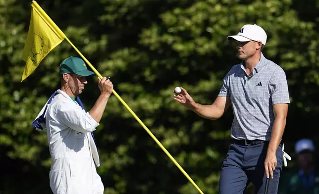 Ludvig Aberg, of Sweden, waves after making a putt on the 11th hole during final round at the Masters golf tournament at Augusta National Golf Club Sunday, April 14, 2024, in Augusta, Ga. (AP Photo/George Walker IV)