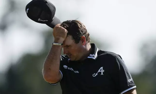 Patrick Reed reacts after missing a putt on the 18th hole during final round at the Masters golf tournament at Augusta National Golf Club Sunday, April 14, 2024, in Augusta, Ga. (AP Photo/David J. Phillip)