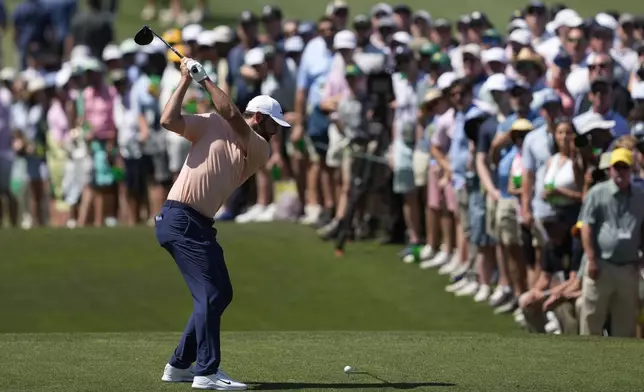 Scottie Scheffler hits his tee shot on the third hole during final round at the Masters golf tournament at Augusta National Golf Club Sunday, April 14, 2024, in Augusta, Ga. (AP Photo/David J. Phillip)