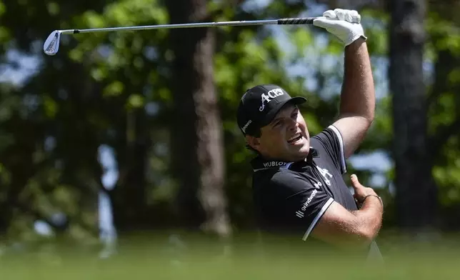 Patrick Reed reacts to his tee shot on the fourth hole during final round at the Masters golf tournament at Augusta National Golf Club Sunday, April 14, 2024, in Augusta, Ga. (AP Photo/Ashley Landis)