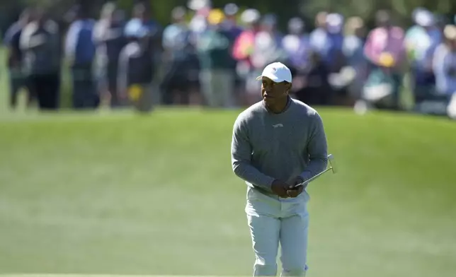 Tiger Woods lines up a putt on the third hole during second round at the Masters golf tournament at Augusta National Golf Club Friday, April 12, 2024, in Augusta, Ga. (AP Photo/Matt Slocum)