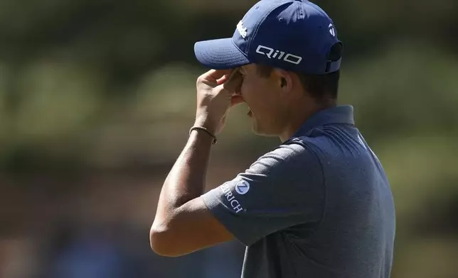 Collin Morikawa reacts after missing a putt on the seventh hole during final round at the Masters golf tournament at Augusta National Golf Club Sunday, April 14, 2024, in Augusta, Ga. (AP Photo/David J. Phillip)