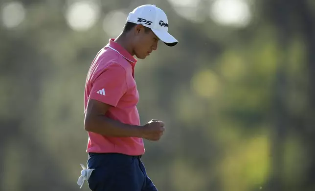 Collin Morikawa celebrates after a putt on the 17th hole during third round at the Masters golf tournament at Augusta National Golf Club Saturday, April 13, 2024, in Augusta, Ga. (AP Photo/Matt Slocum)