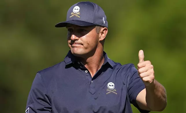 Bryson DeChambeau gestures after finishing the 12th hole during final round at the Masters golf tournament at Augusta National Golf Club Sunday, April 14, 2024, in Augusta, Ga. (AP Photo/George Walker IV)