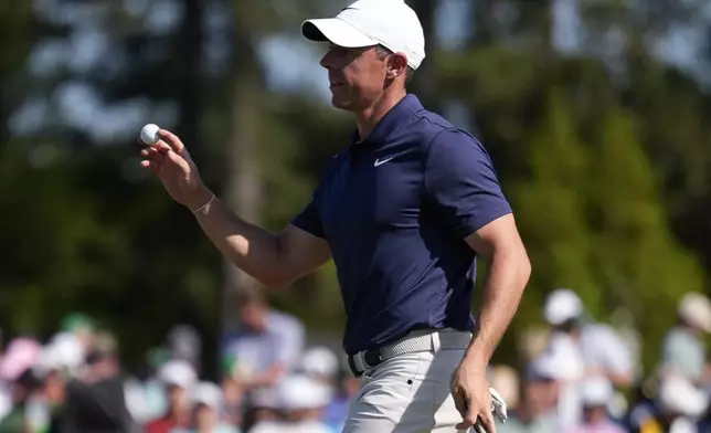Rory McIlroy, of Northern Ireland, waves after making a putt on the 18th hole during final round at the Masters golf tournament at Augusta National Golf Club Sunday, April 14, 2024, in Augusta, Ga. (AP Photo/Ashley Landis)