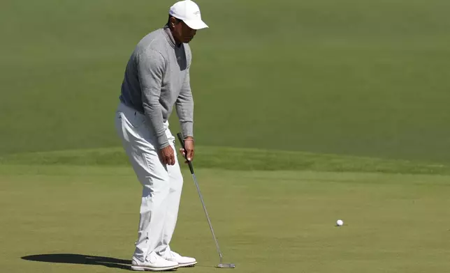 Tiger Woods reacts after missing a putt on the second hole during second round at the Masters golf tournament at Augusta National Golf Club Friday, April 12, 2024, in Augusta, Ga. (AP Photo/Ashley Landis)