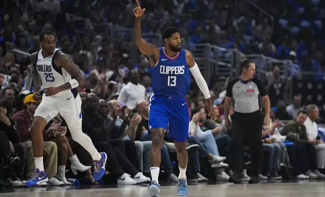 LA Clippers forward Paul George (13) celebrates after making a 3-pointer during the first half of Game 1 of an NBA basketball first-round playoff series against the Dallas Mavericks in Los Angeles, Sunday, April 21, 2024. (AP Photo/Ashley Landis)
