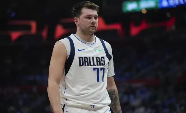 Dallas Mavericks guard Luka Doncic (77) reacts to a foul call during the first half of Game 1 of an NBA basketball first-round playoff series against the LA Clippers in Los Angeles, Sunday, April 21, 2024. (AP Photo/Ashley Landis)