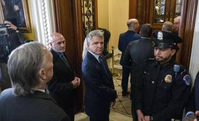 House Foreign Affairs Committee Chairman Michael McCaul, R-Texas, waits outside the Senate Chamber with fellow House Impeachment managers to deliver the Secretary Mayorkas Impeachment Articles to the Senate on Monday, April 15, 2024, in Washington. (AP Photo/Kevin Wolf)