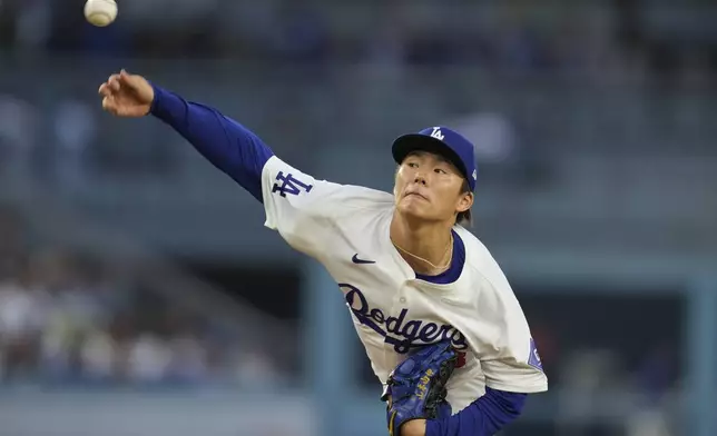Los Angeles Dodgers starting pitcher Yoshinobu Yamamoto (18) throws during the first inning of a baseball game against the New York Mets in Los Angeles, Friday, April 19, 2024. (AP Photo/Ashley Landis)