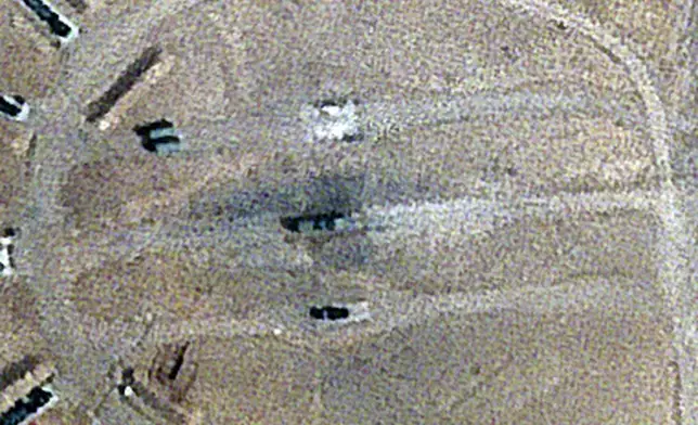 Burn marks surround what analysts identify as a radar system for a Russian-made S-300 missile battery, center, near an international airport and air base is seen in Isfahan, Iran, Monday, April 22, 2024. Satellite photos taken Monday suggest an apparent Israeli retaliatory strike targeting Iran's central city of Isfahan hit a radar system for a Russian-made air defense battery, contradicting repeated denials by officials in Tehran in the time since the assault. (Planet Labs PBC via AP)