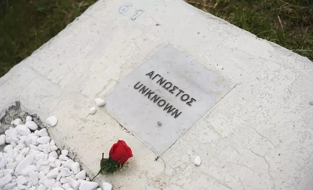 A grave of an unknown refugee is seen at the cemetery in Kato Tritos village on the northeastern Aegean Sea island of Lesbos, Greece, on Wednesday, April 17, 2024. After years of neglect, a primitive burial ground for refugees who died trying to reach Greece's island of Lesbos has been cleaned up and redesigned to provide a dignified resting place for the dead. (AP Photo/Panagiotis Balaskas)