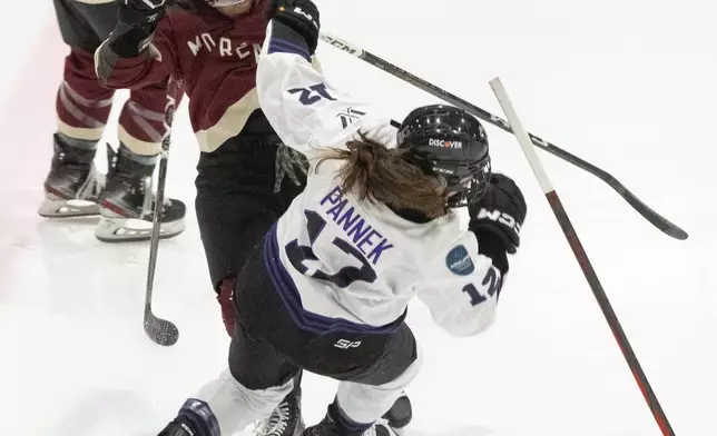 Montreal's Mikyla Grant-Mentis, left, collides with Minnesota's Kelly Pannek (12) during the first period of a PWHL hockey game Thursday, April 18, 2024, in Montreal. (Christinne Muschi/The Canadian Press via AP)