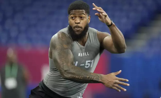 FILE - Florida State defensive lineman Jared Verse runs a drill at the NFL football scouting combine, Thursday, Feb. 29, 2024, in Indianapolis. Verse is a possible first round pick in the NFL Draft. (AP Photo/Michael Conroy, File)