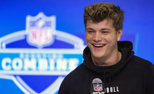 FILE - Michigan quarterback J.J. McCarthy speaks during a press conference at the NFL football scouting combine in Indianapolis, Friday, March 1, 2024. McCarthy is a possible first round pick in the NFL Draft.(AP Photo/Michael Conroy, File)