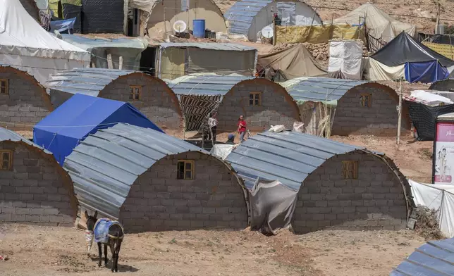 Makeshift homes for people who have been displaced by the earthquake, in Douzrou, near Marrakech, Thursday, April 4, 2024. (AP Photo)