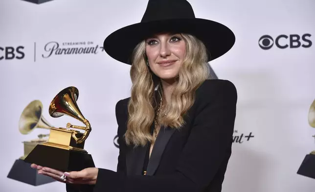 FILE - Lainey Wilson poses in the press room with the award for best country album for "Bell Bottom Country" during the 66th annual Grammy Awards on Sunday, Feb. 4, 2024, in Los Angeles. With the release of "Act II: Cowboy Carter,'' Beyoncé has reignited discussions about the genre’s origins and its diversity. (Photo by Richard Shotwell/Invision/AP, File)