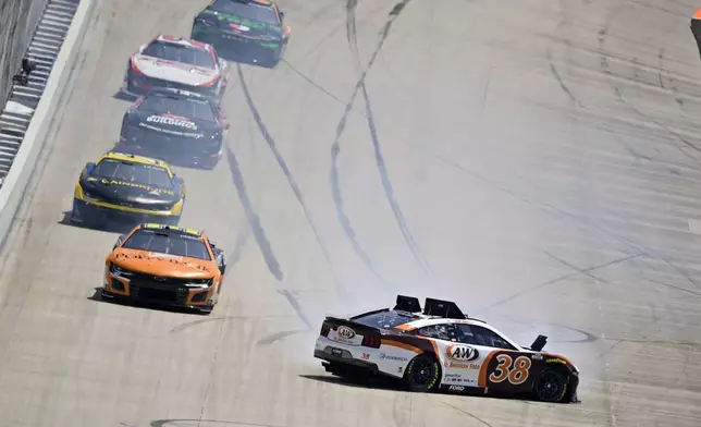 Todd Gilliland (38) spins on the front stretch during a NASCAR Cup Series auto race at Dover Motor Speedway, Sunday, April 28, 2024, in Dover, Del. (AP Photo/Derik Hamilton)