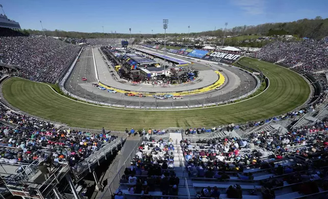 Drivers race around the track during a NASCAR Cup Series auto race at Martinsville Speedway in Martinsville, Va., Sunday, April 7, 2024. (AP Photo/Chuck Burton)