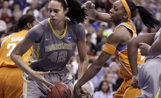 FILE - In this March, 2012, file photo, Baylor's Brittney Griner grabs a rebound in front of Tennessee's Glory Johnson during an NCAA college basketball tournament regional final in Des Moines, Iowa. Griner led Baylor to its first unbeaten season and the school became the first to ever win 40 games. (AP Photo/Charlie Neibergall, File)