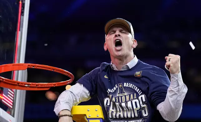 UConn head coach Dan Hurley celebrates cutting the net after the NCAA college Final Four championship basketball game against Purdue, Monday, April 8, 2024, in Glendale, Ariz. (AP Photo/Brynn Anderson)