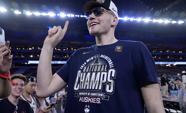 UConn center Donovan Clingan celebrates after the NCAA college Final Four championship basketball game against Purdue, Monday, April 8, 2024, in Glendale, Ariz. (AP Photo/Brynn Anderson)