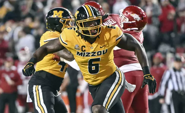 FILE - Missouri defensive lineman Darius Robinson (6) plays against Arkansas during an NCAA college football game Nov. 24, 2023, in Fayetteville, Ark. The Arizona Cardinals selected Robinson in the NFL draft Thursday, April 25. (AP Photo/Michael Woods, FIle)