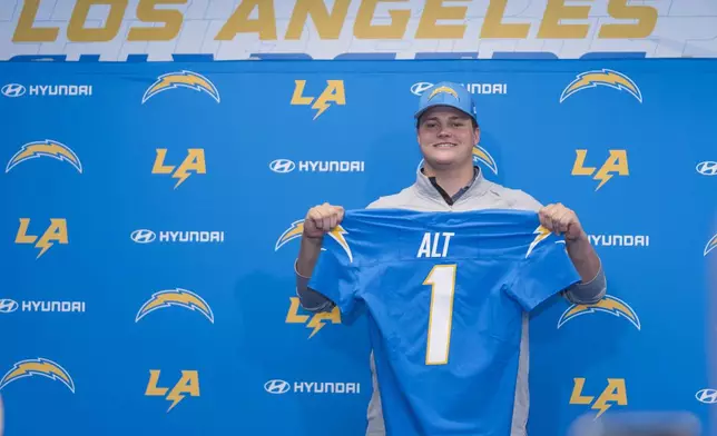Los Angeles Chargers draft pick Joe Alt is introduced at the Chargers Media Center at Hoag Performance Center on Friday, April 26, 2024, in Costa Mesa, Calif. The Los Angeles Chargers opened the Jim Harbaugh era by taking Notre Dame offensive tackle Joe Alt instead of giving Justin Herbert a No. 1 wide receiver to replace Keenan Allen and Mike Williams. (AP Photo/Damian Dovarganes)