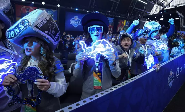 Detroit Lions fans attend the second night of the NFL football draft, Friday, April 26, 2024, in Detroit. (AP Photo/Paul Sancya)
