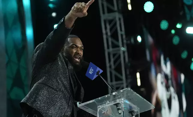 Brandon Graham of the Philadelphia Eagles announces a pick for the Philadelphia Eagles during the second night of the NFL football draft, Friday, April 26, 2024, in Detroit. (AP Photo/Jeff Roberson)