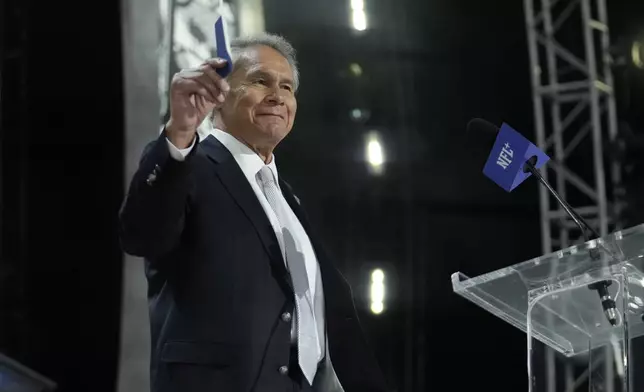 Former player Jim Plunkett announces a pick for the Las Vegas Raiders during the second round of the NFL football draft, Friday, April 26, 2024, in Detroit. (AP Photo/Jeff Roberson)