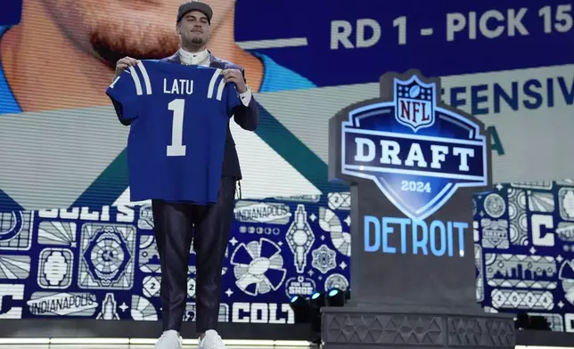 UCLA defensive lineman Laiatu Latu poses after being chosen by the Indianapolis Colts with the 15th overall pick during the first round of the NFL football draft, Thursday, April 25, 2024, in Detroit. (AP Photo/Jeff Roberson)