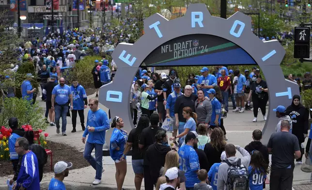 Fans attend the third day of the NFL football draft, Saturday, April 27, 2024, in Detroit. (AP Photo/Jeff Roberson)