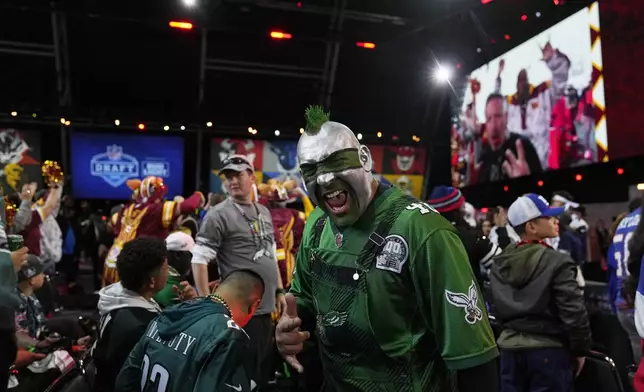 A Philadelphia Eagles fan cheers during the second round of the NFL football draft, Friday, April 26, 2024, in Detroit. (AP Photo/Jeff Roberson)