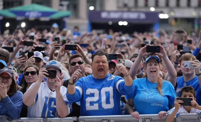 Fans cheer during the third day of the NFL football draft, Saturday, April 27, 2024, in Detroit. (AP Photo/Paul Sancya)