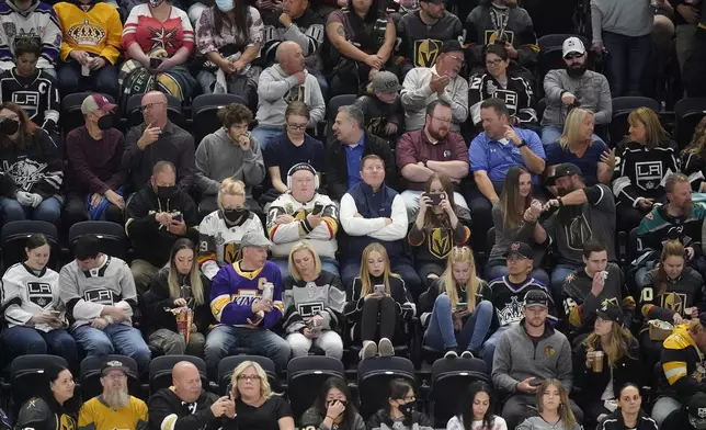 Fans occupy their seats before an NHL hockey preseason game between the Vegas Golden Knights and the Los Angeles Kings, Sept. 30, 2021, in Salt Lake City. Hockey has started to take off locally since Salt Lake City began hosting Frozen Fury, an NHL preseason exhibition game, in 2021. (AP Photo/Rick Bowmer)