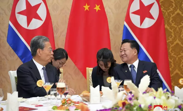 In this photo provided on April 12, 2024, by the North Korean government, Choe Ryong Hae, right, vice-chairman of the central committee of the Workers' Party of North Korea, talks with Zhao Leji, left, chairman of the National People’s Congress of China during a reception, at the Mansudae Assembly Hall in Pyongyang, North Korea, on April 11, 2024. (Korean Central News Agency/Korea News Service via AP)