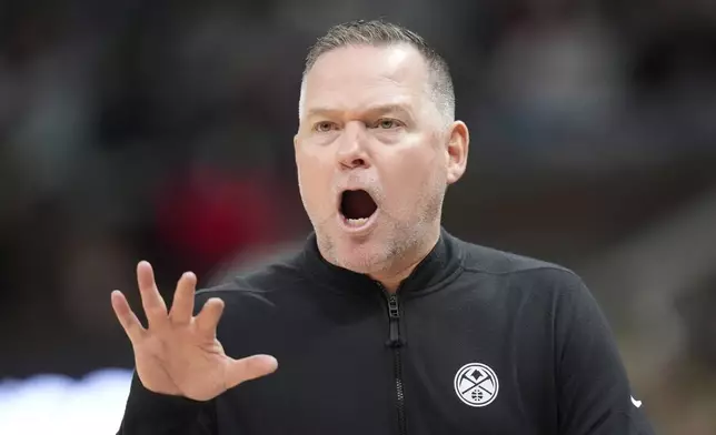 Denver Nuggets head coach Michael Malone shouts during in the first half of an NBA basketball game against the Utah Jazz Tuesday, April 9, 2024, in Salt Lake City. . (AP Photo/Rick Bowmer)
