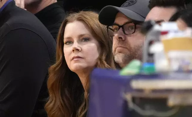 Actress Amy Adams watches during the first half in Game 4 of an NBA basketball first-round playoff series between the Los Angeles Lakers and the Denver Nuggets Saturday, April 27, 2024, in Los Angeles. (AP Photo/Mark J. Terrill)