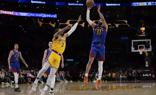 Denver Nuggets guard Jamal Murray (27) shoots against Los Angeles Lakers guard Gabe Vincent (7) during the first half of Game 3 of an NBA basketball first-round playoff series in Los Angeles, Thursday, April 25, 2024. (AP Photo/Ashley Landis)