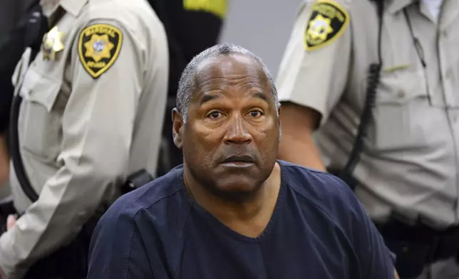 FILE - In this May 14, 2013, file photo, O.J. Simpson sits during a break on the second day of an evidentiary hearing in Clark County District Court in Las Vegas. O.J. Simpson's attorney Malcolm LaVergne is now handling the deceased former football star, actor and famous murder defendant's financial estate. (AP Photo/Ethan Miller, Pool, File)