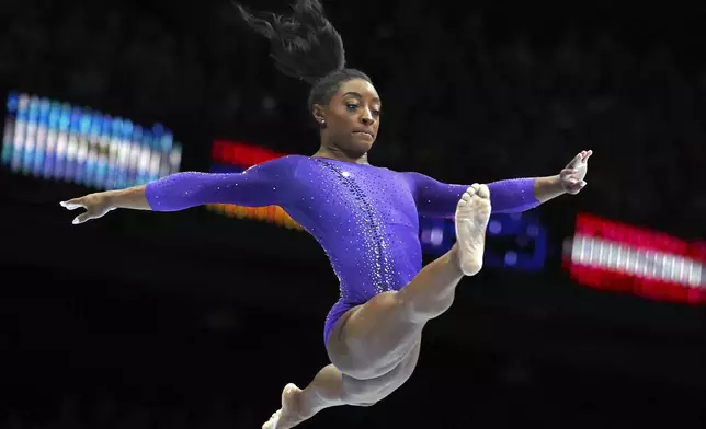 FILE - United States' Simone Biles competes on the beam during the apparatus finals at the Artistic Gymnastics World Championships in Antwerp, Belgium, Sunday, Oct. 8, 2023. (AP Photo/Geert vanden Wijngaert, File)