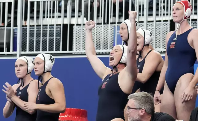 FILE - The team from the United States celebrates after winning against Hungary during the women's water polo final at the World Aquatics Championships in Doha, Qatar, Friday, Feb. 16, 2024. (AP Photo/Lee Jin-man, File)