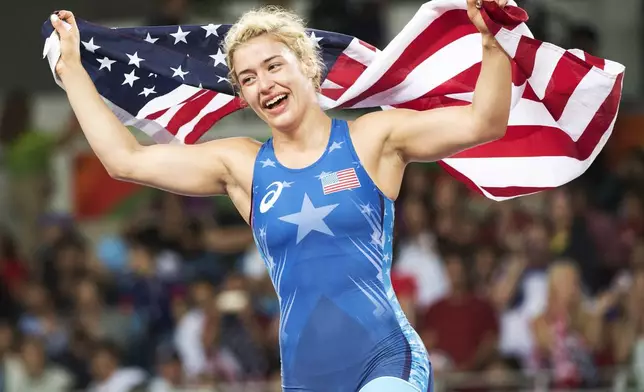 FILE - United States' Helen Louise Maroulis celebrates after beating Japan's Saori Yoshida for the gold medal during the women's wrestling freestyle 53-kg competition at the 2016 Summer Olympics in Rio de Janeiro, Brazil, in this Thursday, Aug. 18, 2016, file photo. The women's competition at the U.S. Olympic wrestling trials features a deep talent pool headed by 2016 Olympic champion Helen Maroulis, the first American woman to win gold. (Ryan Remiorz/The Canadian Press via AP, File)
