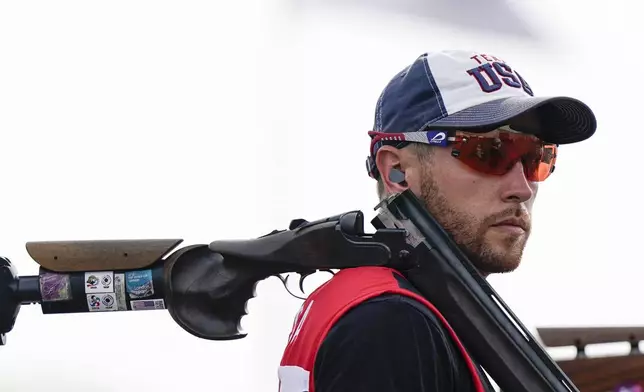 FILE - Vincent Hancock, of the United States, pauses as he competes in the men's skeet at the Asaka Shooting Range in the 2020 Summer Olympics, Monday, July 26, 2021, in Tokyo, Japan. Hancock went on to take the gold medal. (AP Photo/Alex Brandon, File)