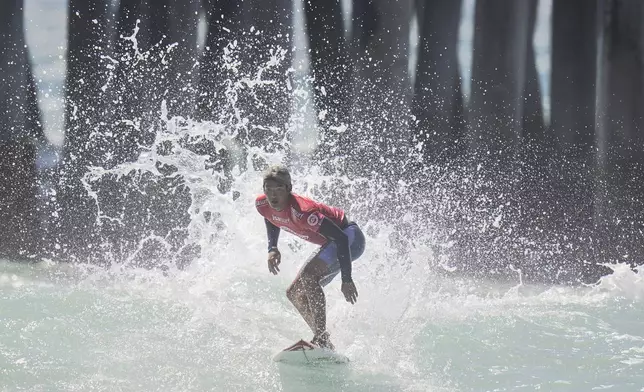 FILE - Kanoa Igarashi, of Japan, competes in the ISA World Surfing Games in Huntington Beach, Calif., Tuesday, Sept. 20, 2022. (AP Photo/Jae C. Hong, File)