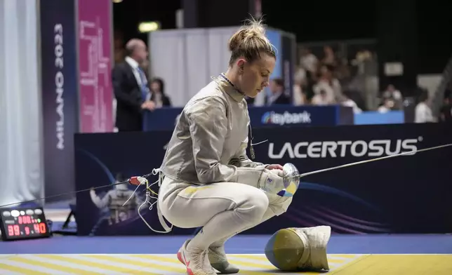 FILE - UKraine's Olga Kharlan concentrates before competing against U.S. Elizabeth Tartakovsky during the women's Team Sabre eight finals, at the Fencing World Championships in Milan, Italy, Sunday, July 30, 2023. (AP Photo/Luca Bruno, File)